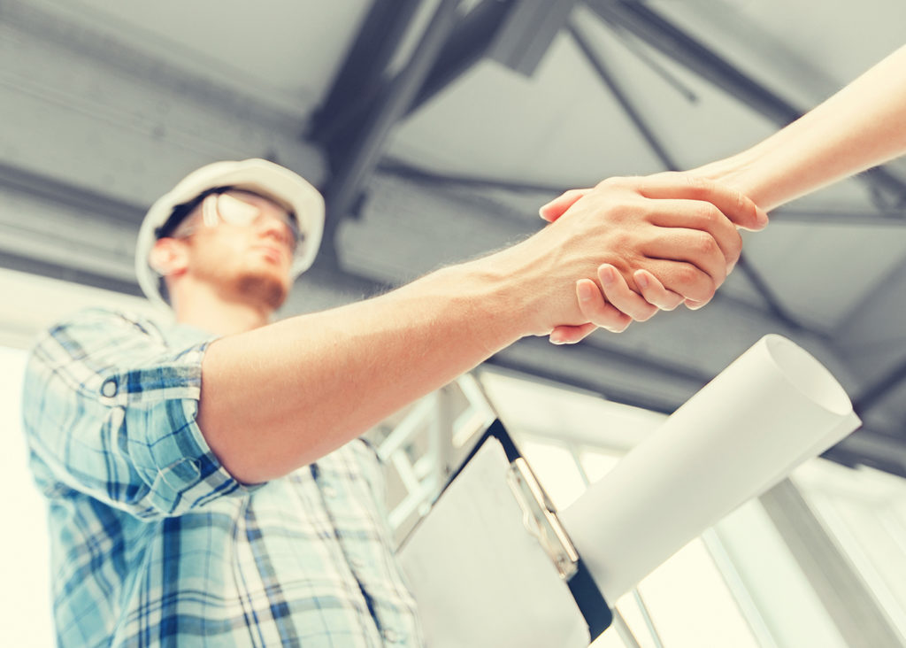 Shaking hands to hire a contractor