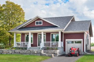Exterior of farm-style model home at “Watercolour Westport” Net Zero Ready community by Land Ark Homes – Westport, ON